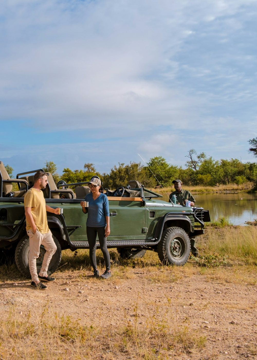 Asian women and European men on safari game drive in South Africa Kruger national park